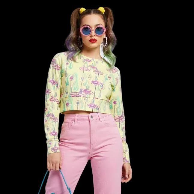 Pastel yellow long sleeve crop top with pink surrealist flower and eye print